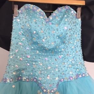 A light turquoise/blue, QUINCEAÑERA gown & jacket